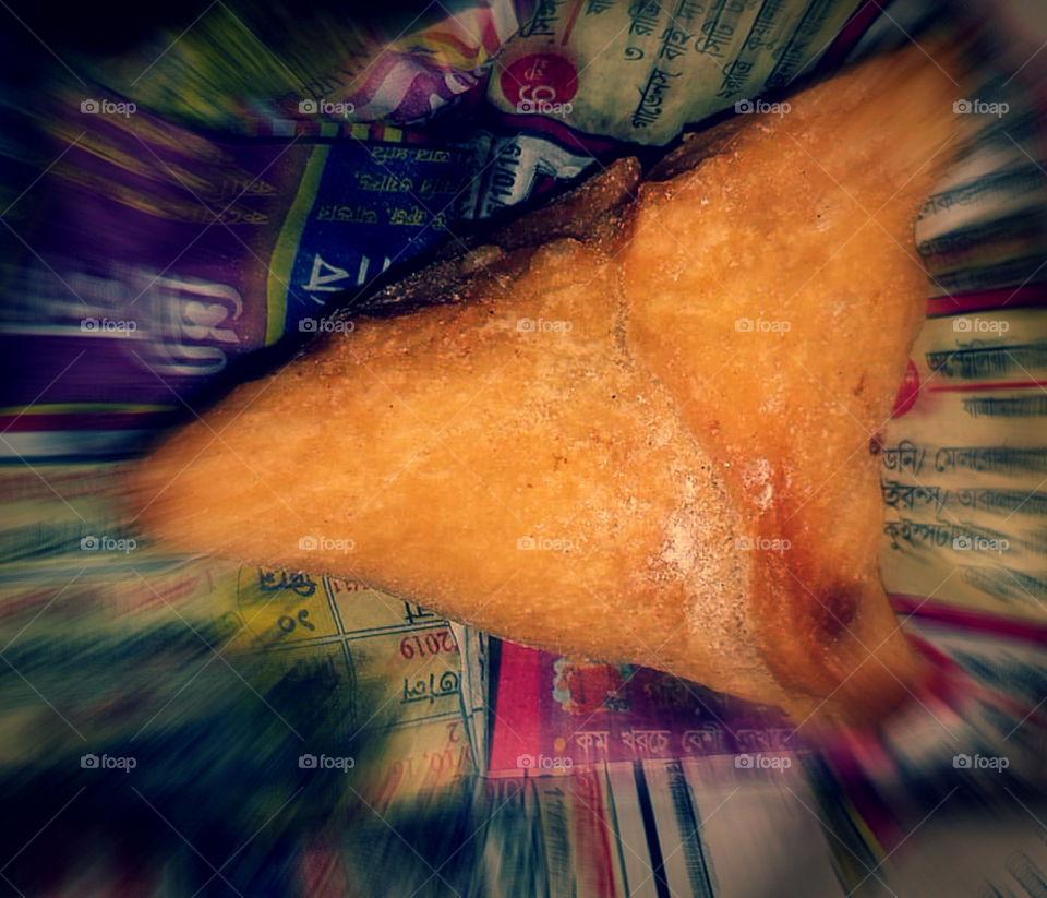 A triangular savoury pastry, "SAMOSA" are crisp fried Indian snack with spicy potato peas filling.Best selling street foods in India.