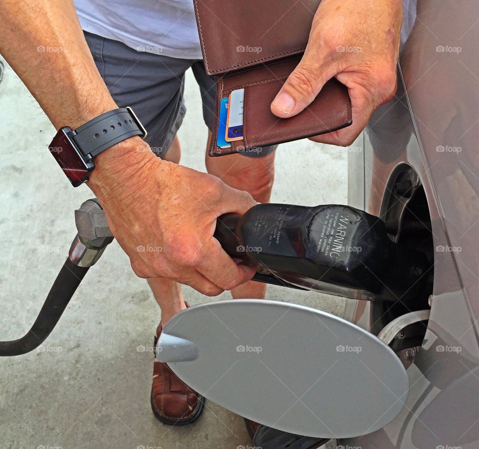 Man pumping gas. Man pumping gas 