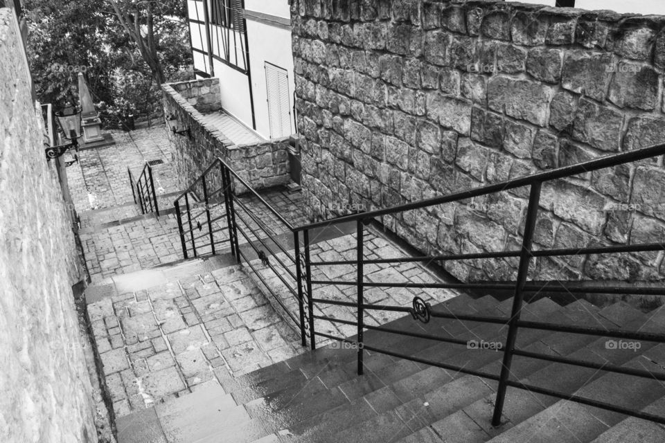 B&W stone finished staircase after the rain.
