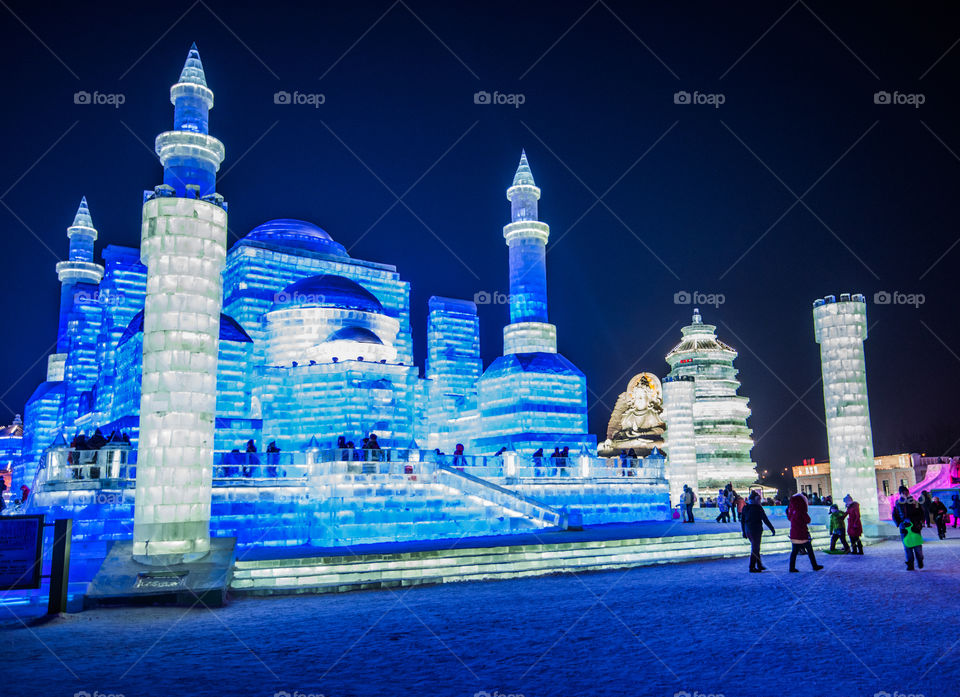 Asia china  Harbin ice Festival snow Festival ice sculptures snow building  snow ice in light colorful ice buildings at night full moon baue moshee