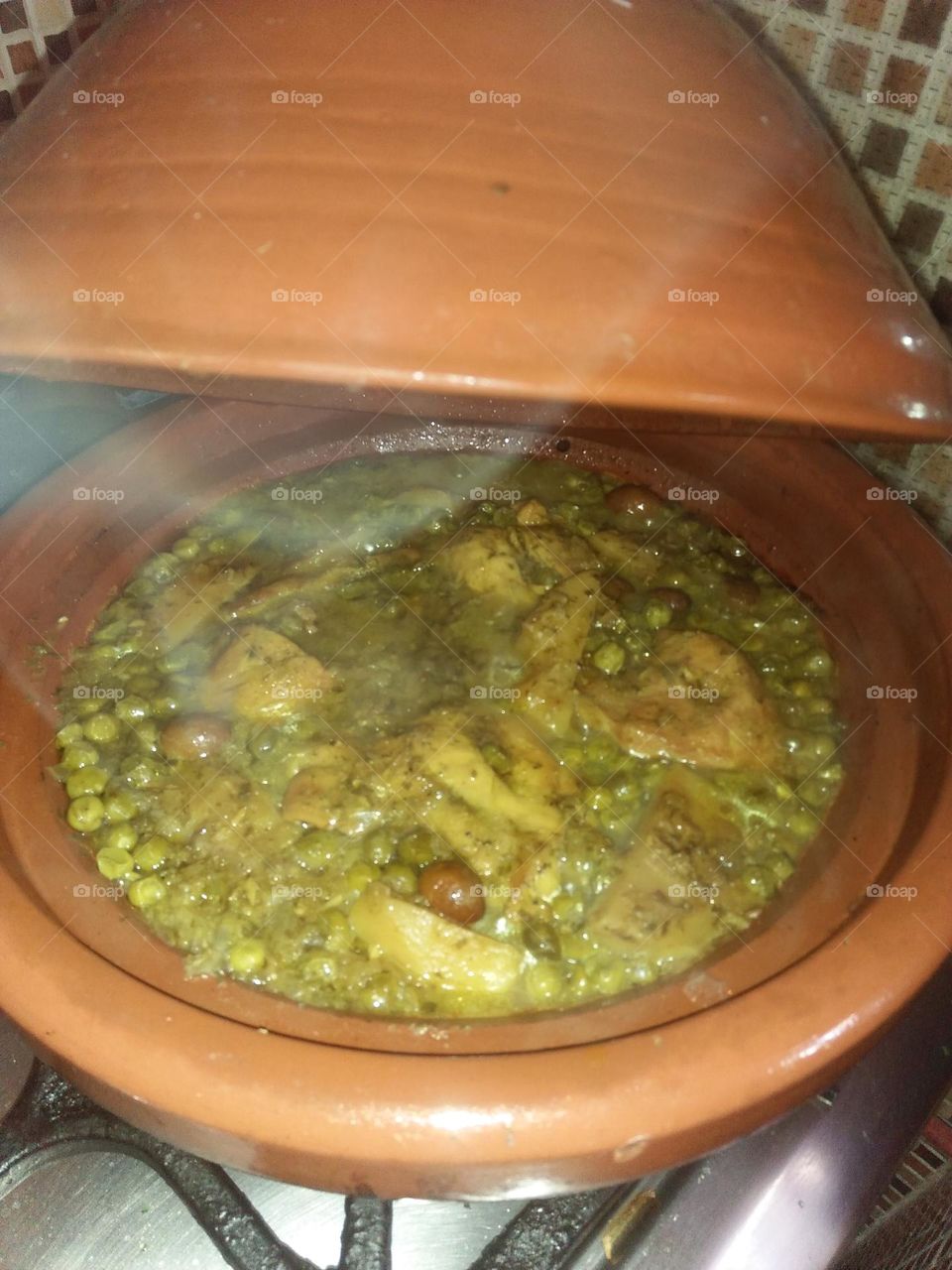 a smoke coming from moroccan Tajine.