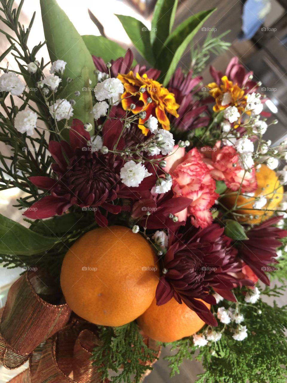 A beautiful, elegant harvest floral and fruit arrangement perfect for the thanksgiving table. 
