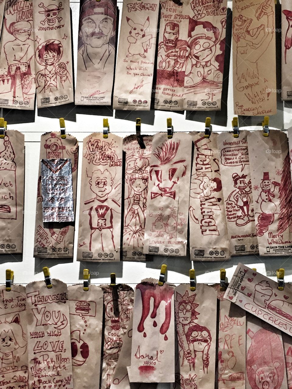 Display of drawings on brown paper sandwich bags