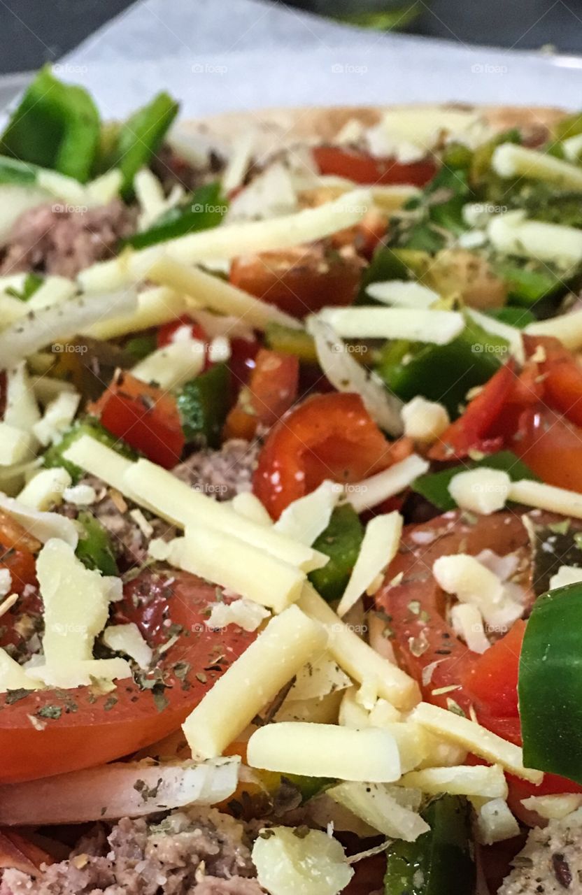 Pizza pie closeup before cooking 