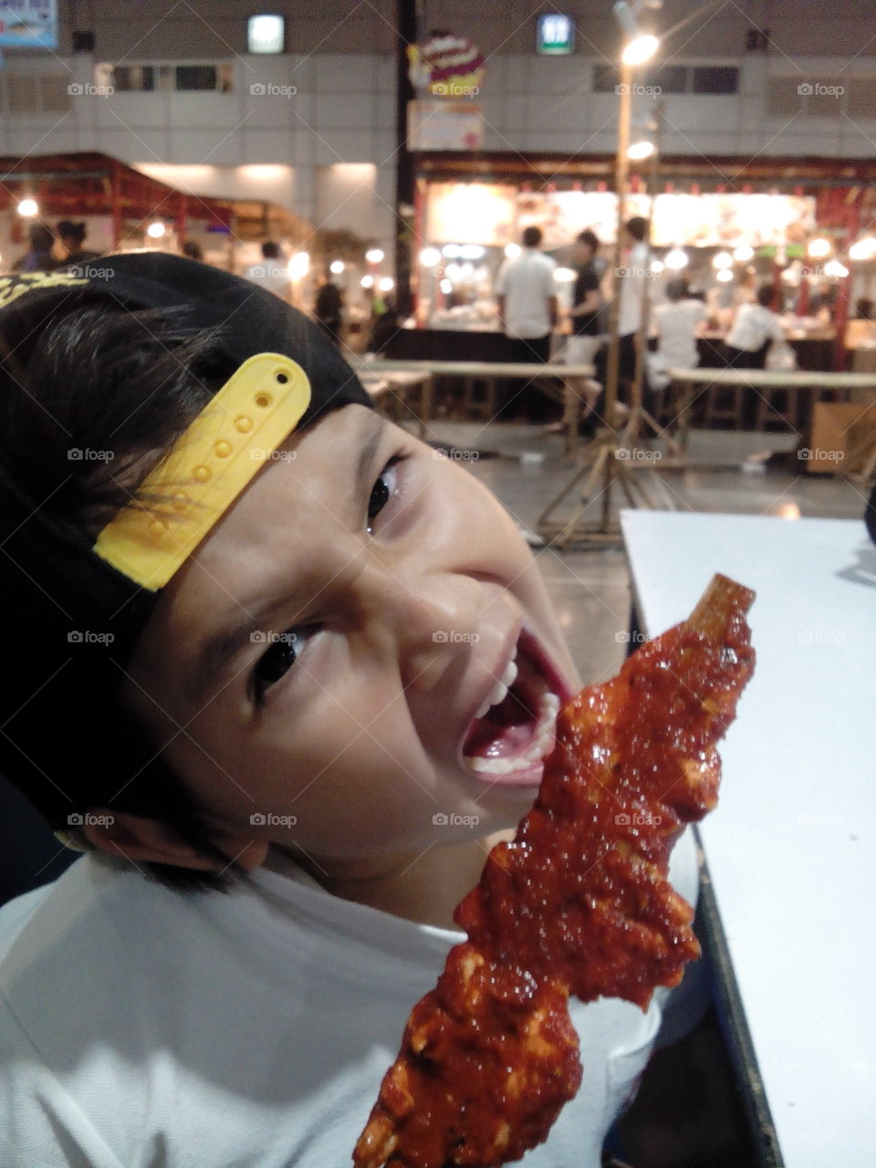 hungry kid eating chicken