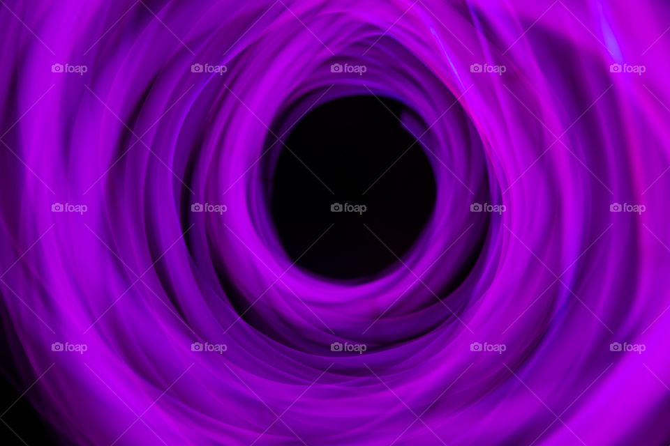 Slow motion circle photograph of the purple light source