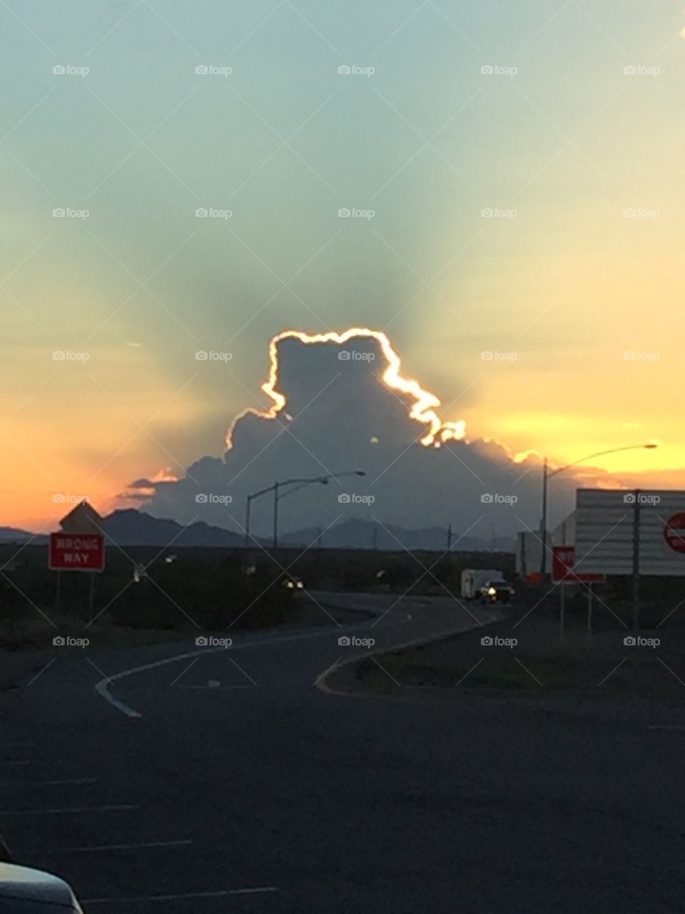 Sun behind cloud
