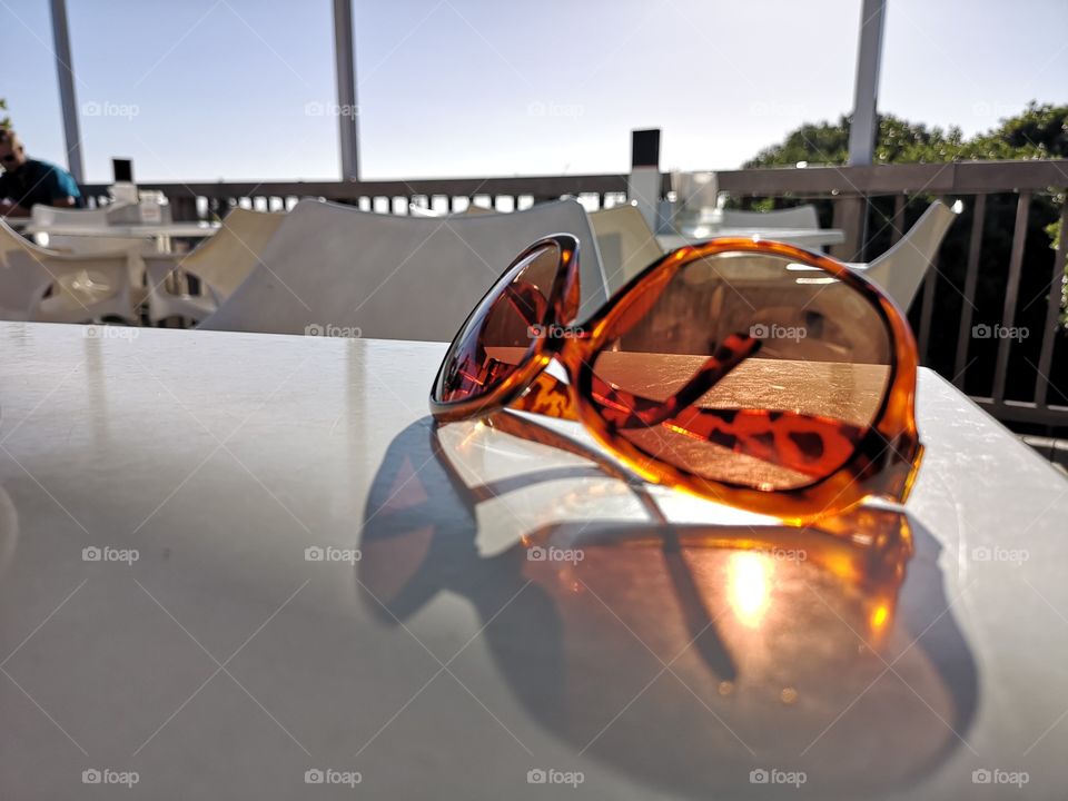 Sunglasses on restaurant table
