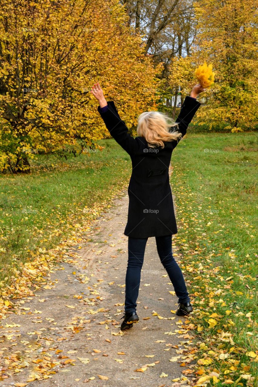 woman relaxing and meditation in the autumn park