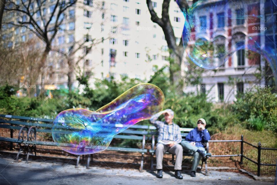 Couples bubbles. Warm spring day in Central Park. 