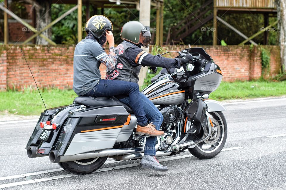 Harley Davidson rider with pillion passenger