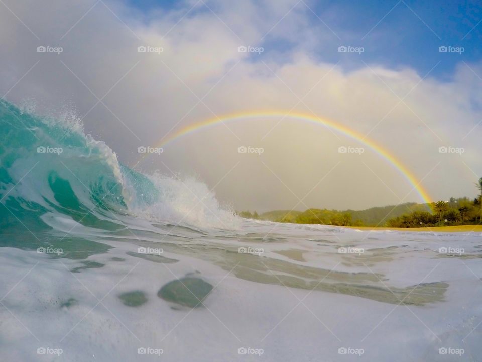 Rainbow and a wave