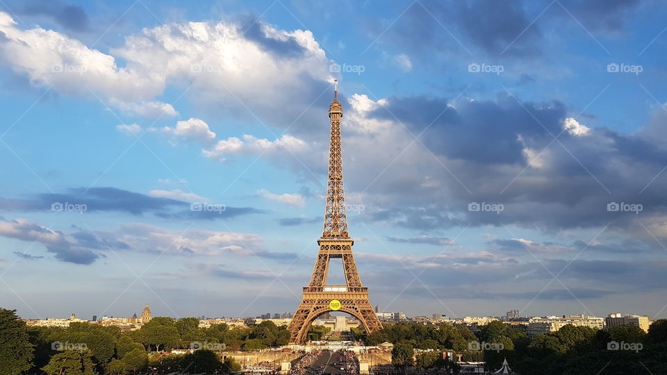 The Eiffel tower with a cloudy sky. Paris. France