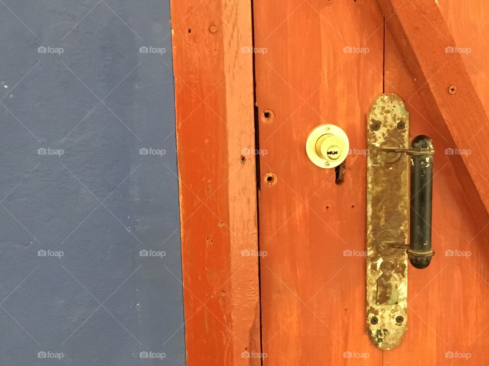Cement and wooden door background. Wooden door lock. 