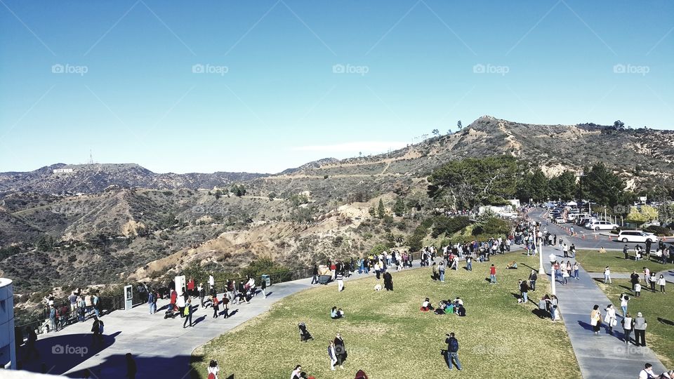 People out overlooking a beautiful view.