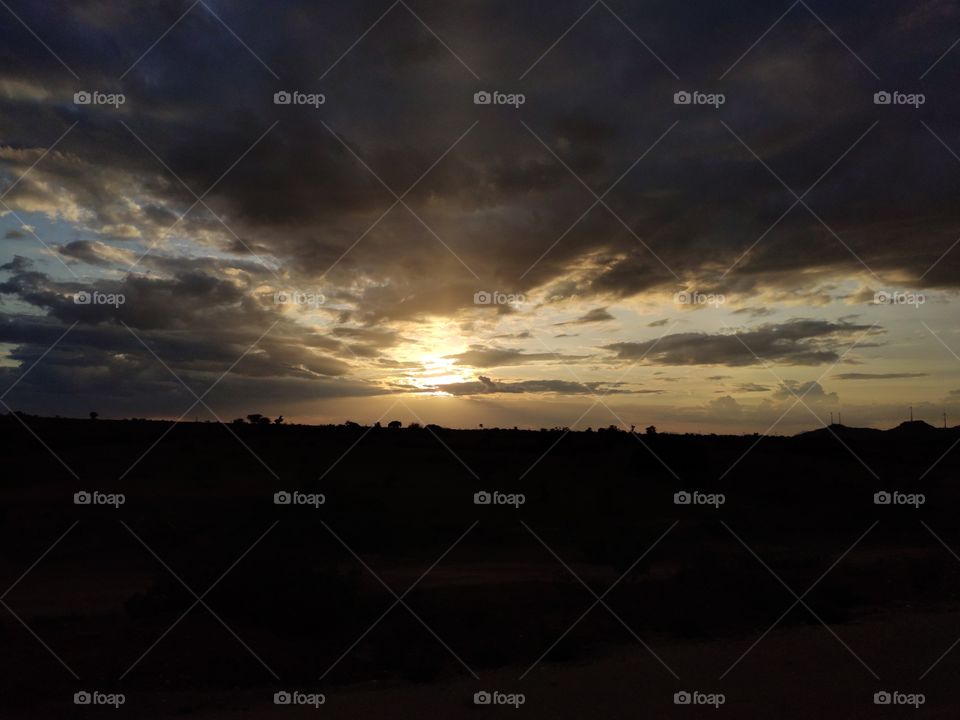 Sunset - Beautiful, Glorious and Brightest Object of mixed colours which separates into its colour s and appears as Rainbow is setting for the day.