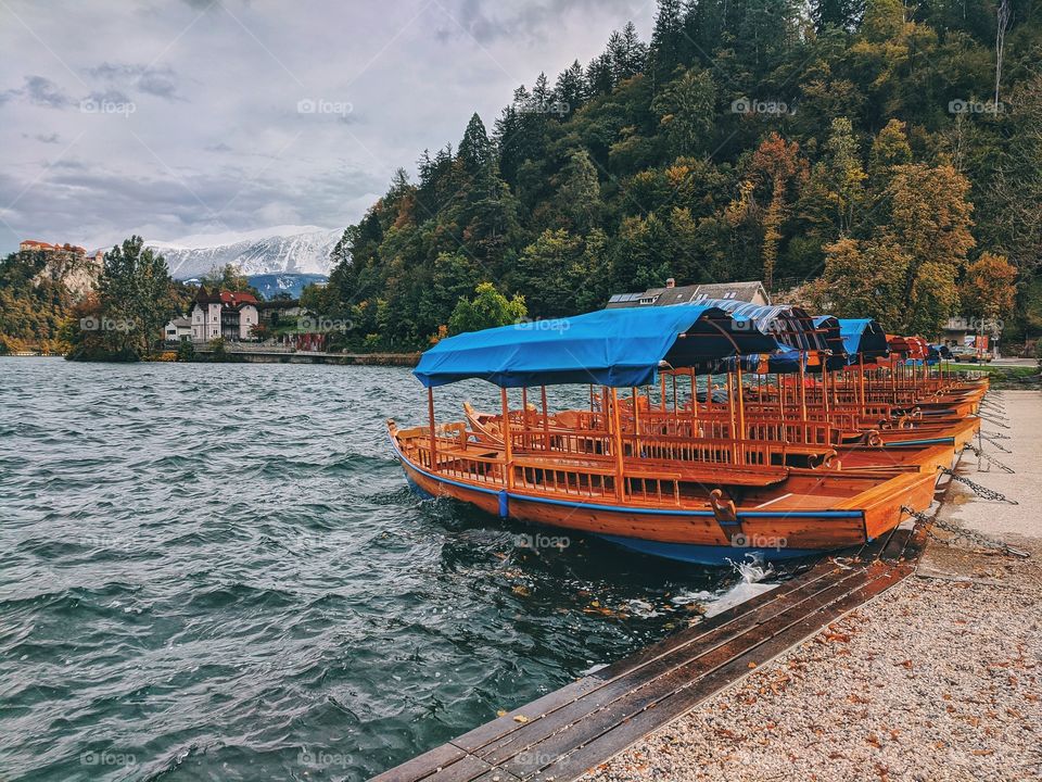 View of the snow-capped mountain peaks against the backdrop of Lake Bled.