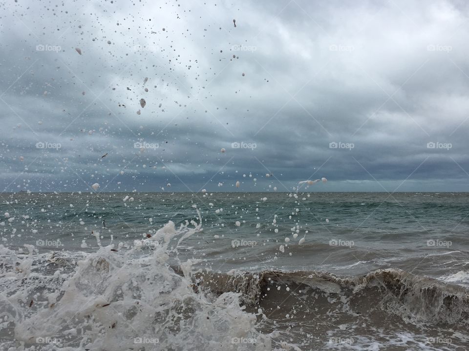 Endless shades of grey in sky, sea, sand, on south Australian coast during severe spring storm 