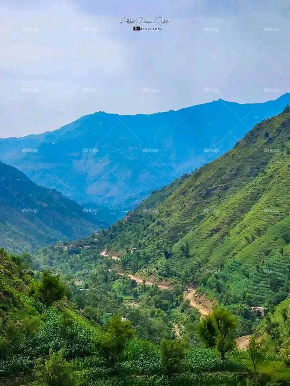 Glory be to God, the magnificent and picturesque view and the natural green trees are a view that is nothing more wonderful than it