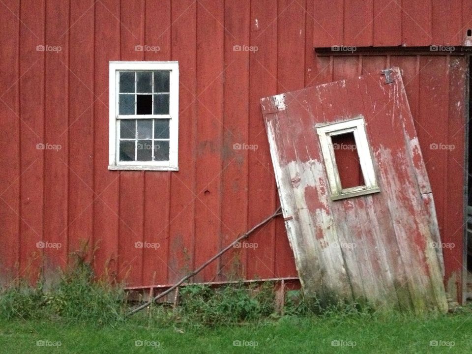 Red barn and broken door