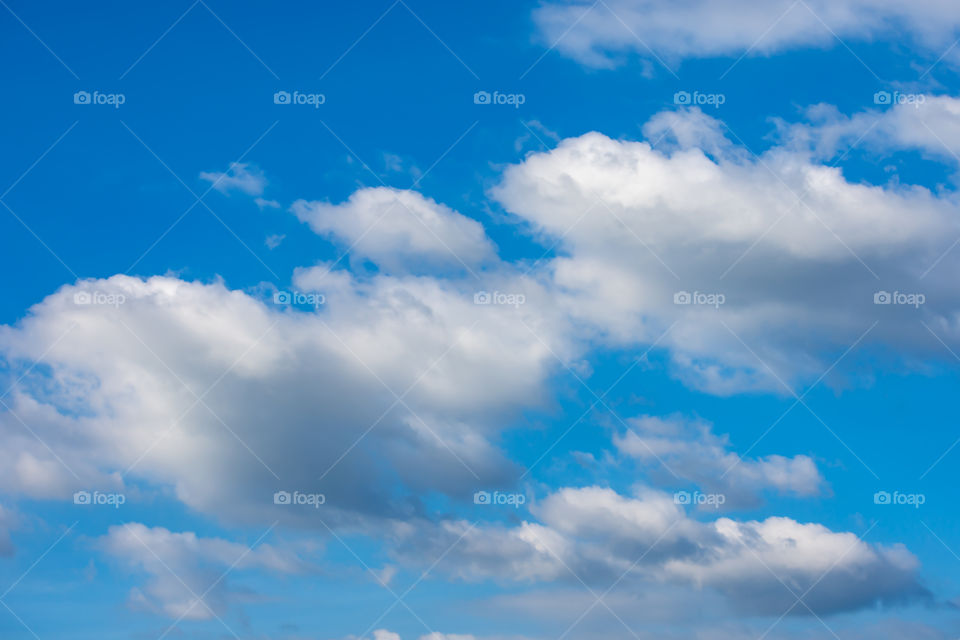 The beauty of the sky with clouds and the sun.