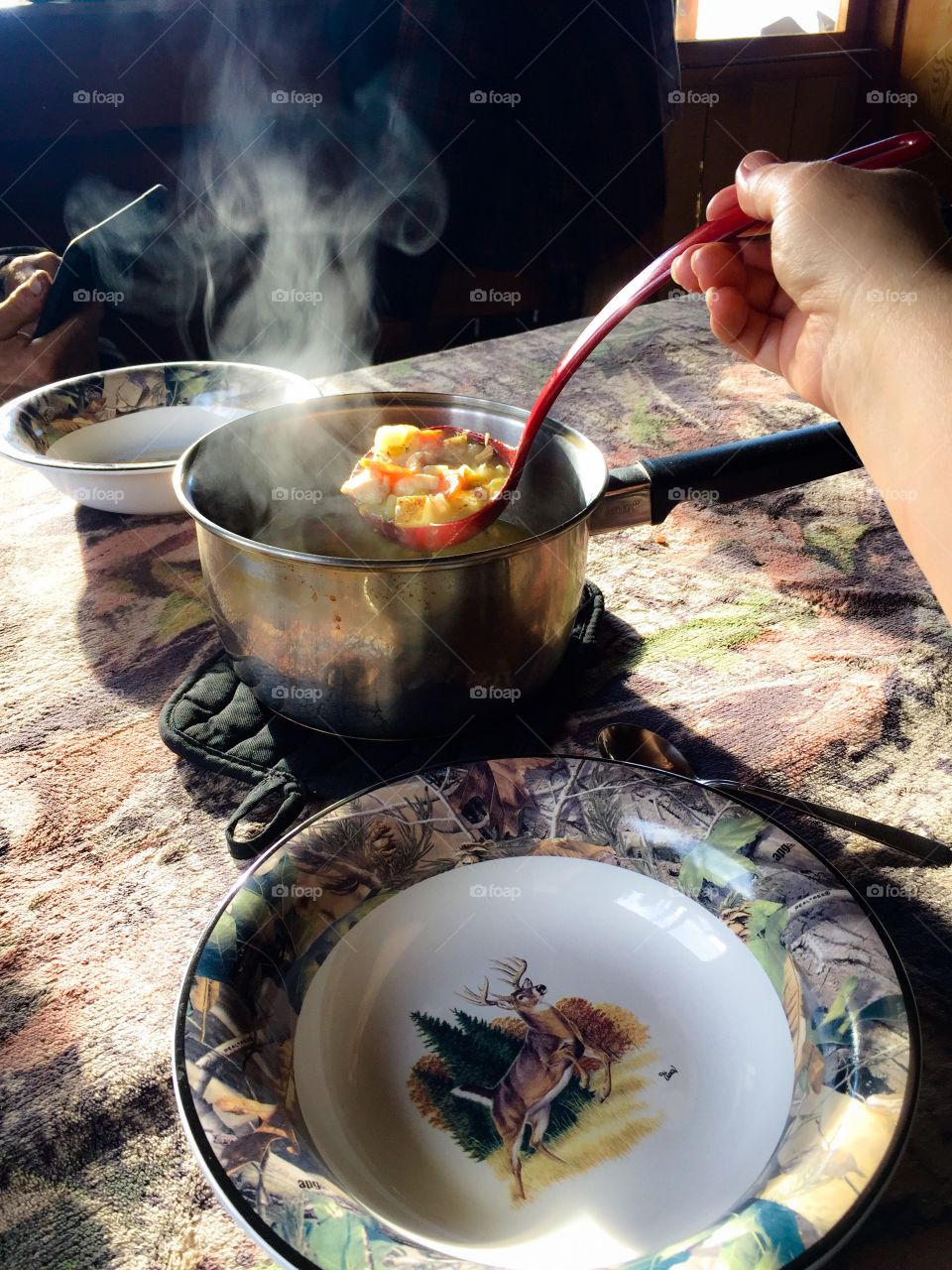 Homemade soup for those long workdays outside. Come in and warm up, soups on! Camo tablecloth & dinnerware for Off Grid wilderness living. 