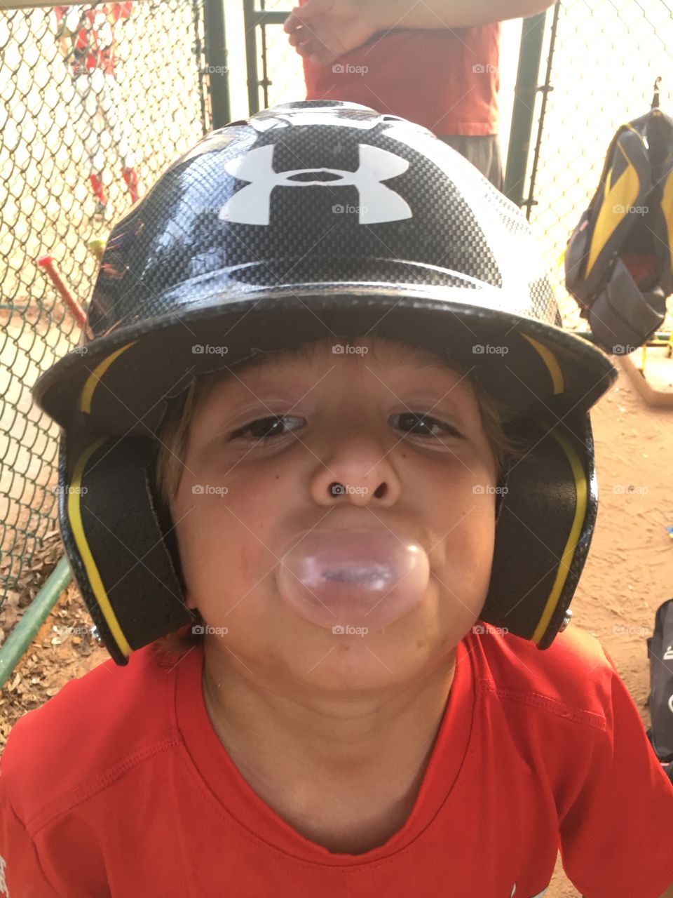 Kid blowing a bubble