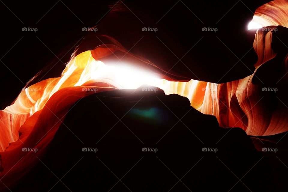 an explosion of yellow colour in a cave with the light