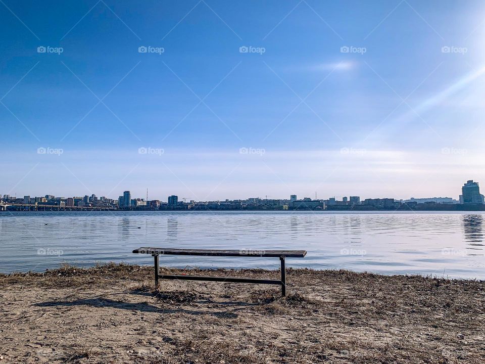 Tranquility, place for thinking, a bench next to big river