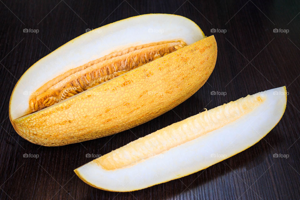 appetizing yellow melon on a wooden table