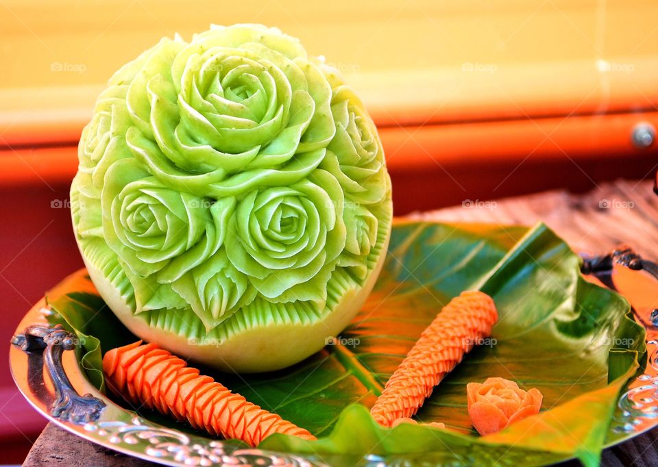 Melon and carrot carving. Roses are everywhere even on fruits! Carrots looked like palm trees after the carvings! 