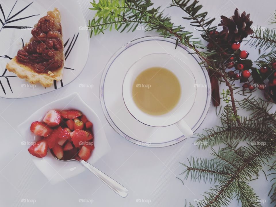 Pecan pie, fresh strawberries and coffee with rustic decor