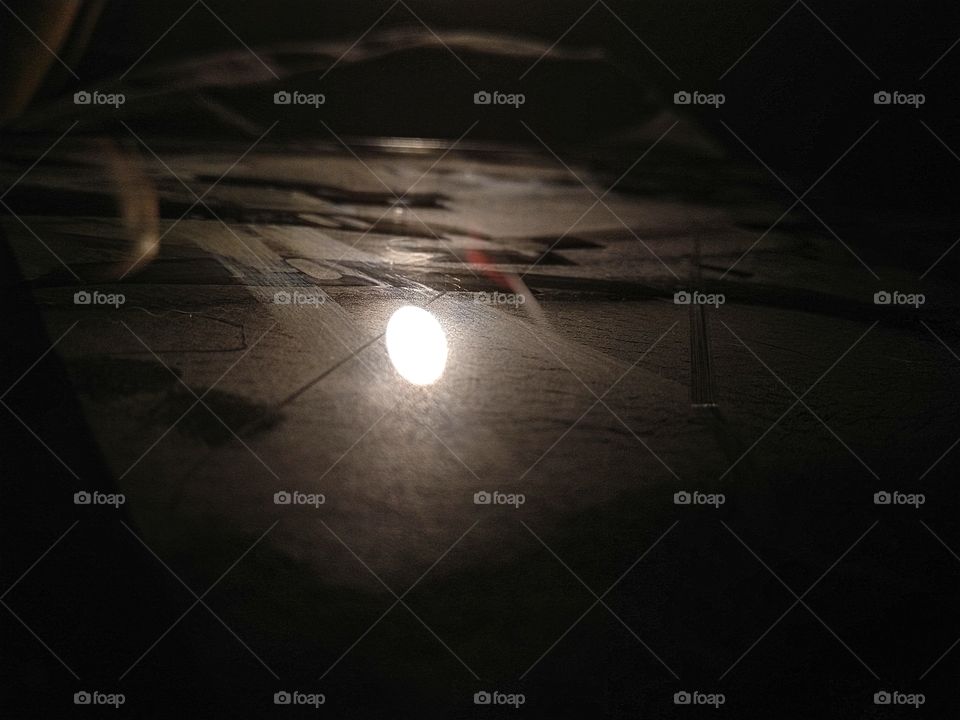 a light reflecting off a dirty iPad/tablet