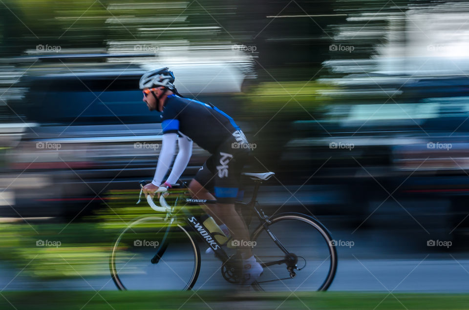 on the move . panning photo of a cyclist