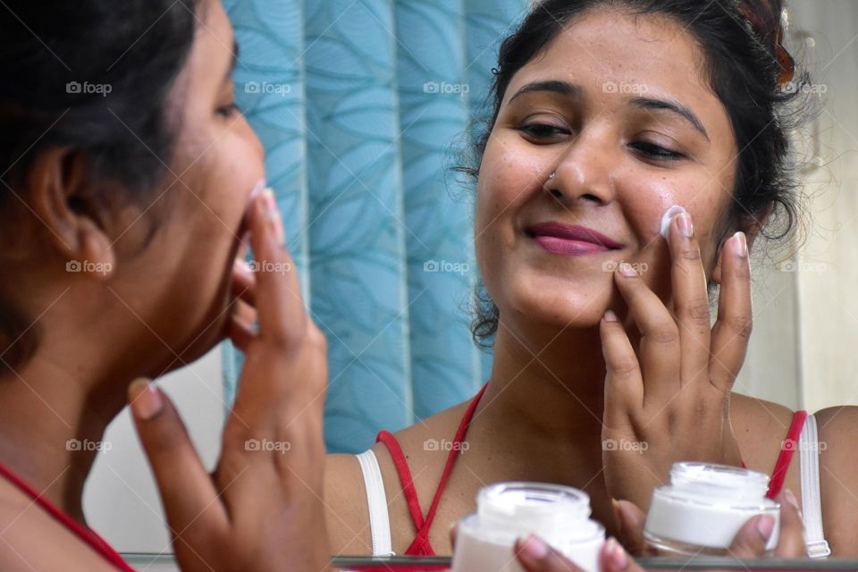 Woman applying cream