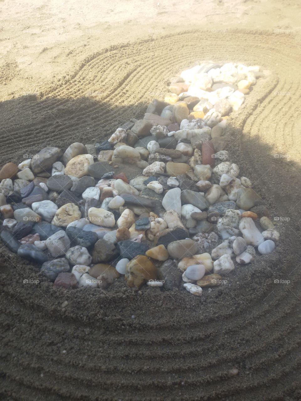 Tree made of rocks on beach