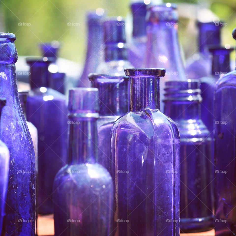 Blue glass bottles at a flea market