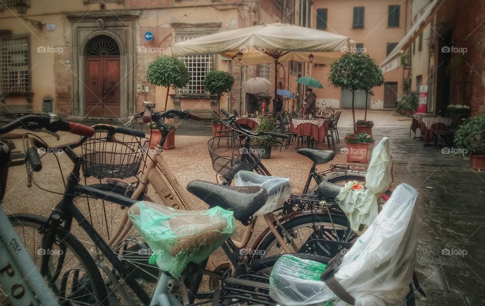 Tuscany, Italy. Bicycles resting in a rainy evening in Tuscany