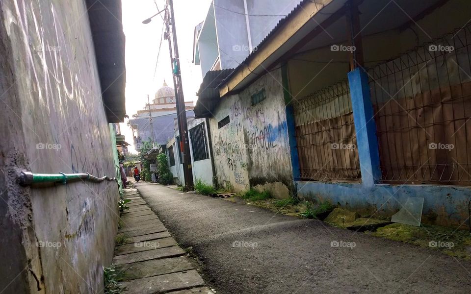 photo of an alley in a slum city