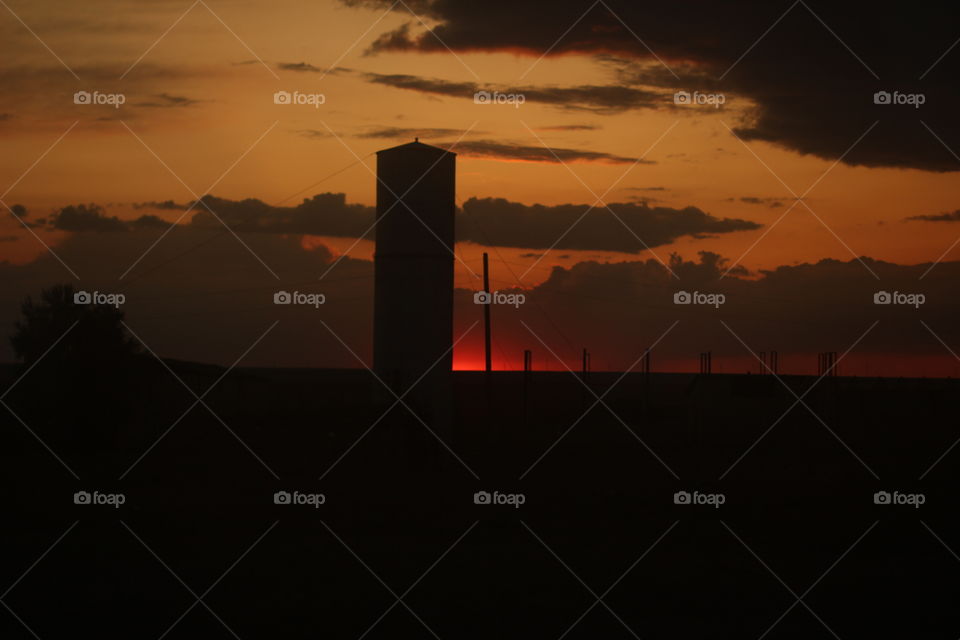 Observation tower on a background of red sunset