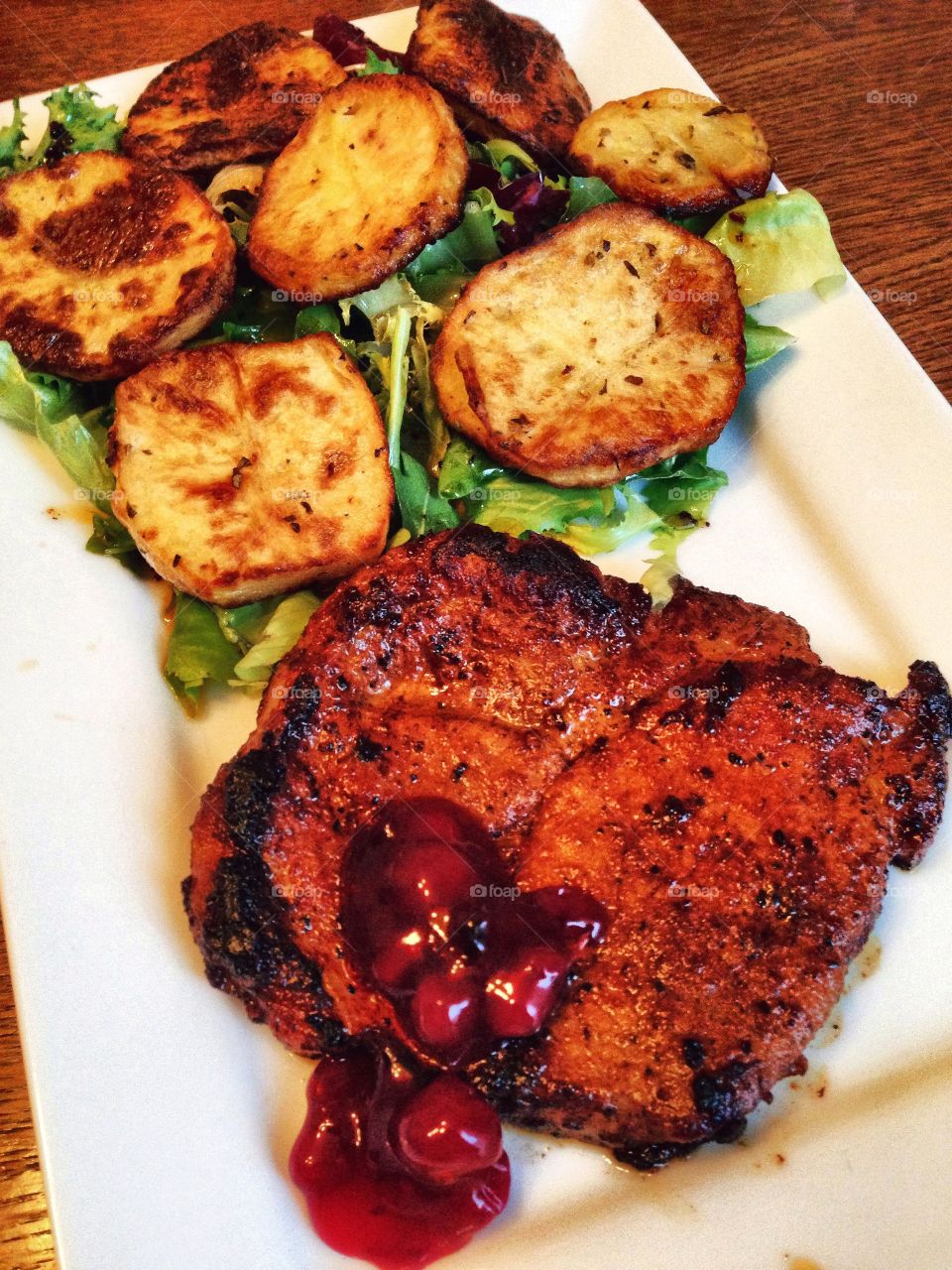 Healthy and yummy . Steak with cranberries sous, vegetables and potatoes 