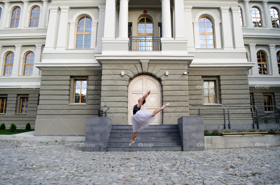 Young Female Ballerina Dancing Outside