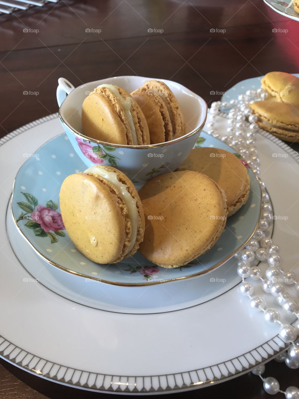 Passionfruit flavoured macaroons filled with white chocolate ganache