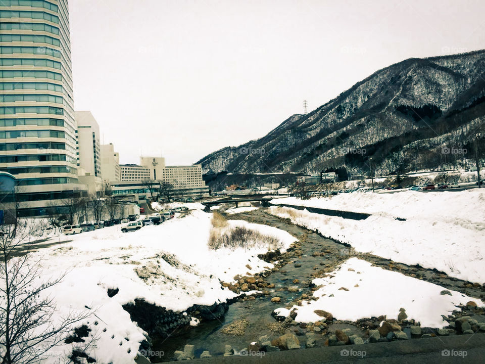 cool stream in a city fully snowfall