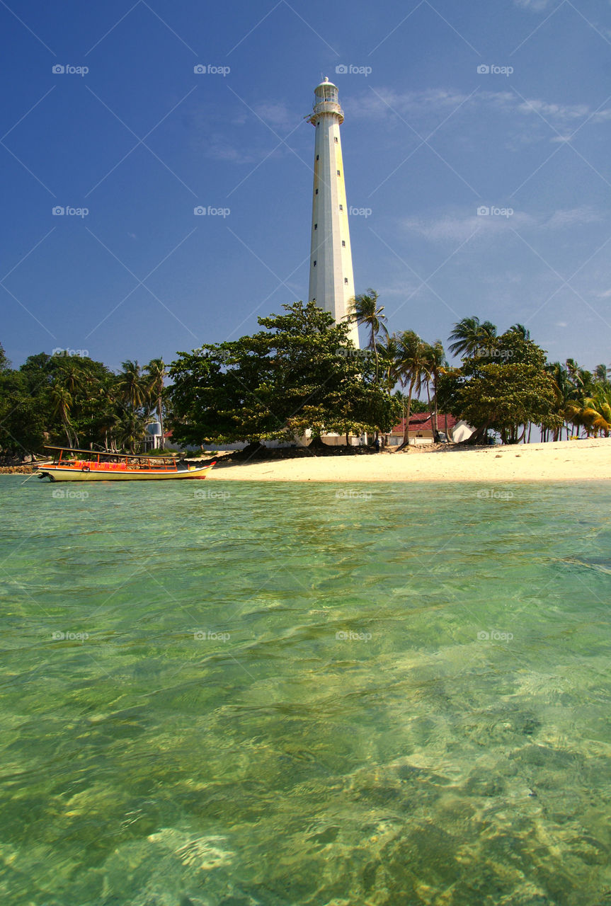 Lighthouse, beach,  and boat in Belitung,  Indonesia