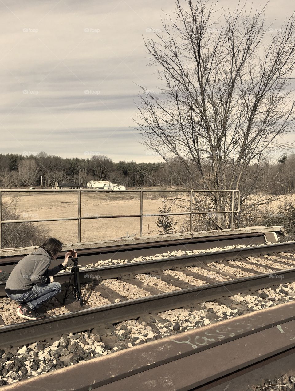 Man photographing railways tracks