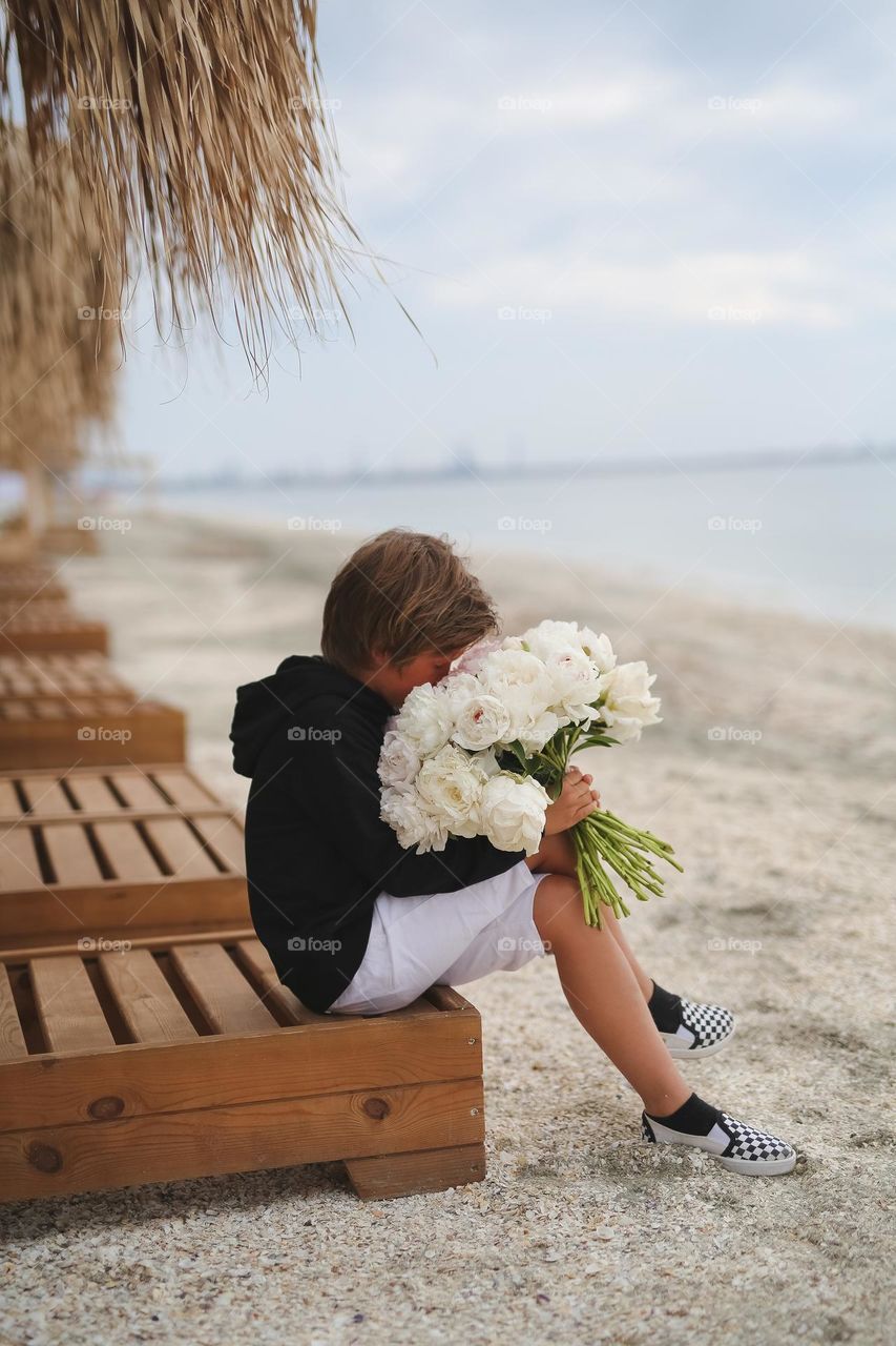 Amazing moment, boy and flowers 