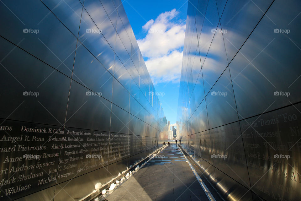 Empty Sky: September 11th Memorial. Liberty State Park, Jersey City, New Jersey. Blue sky with white clouds reflected on the walls.