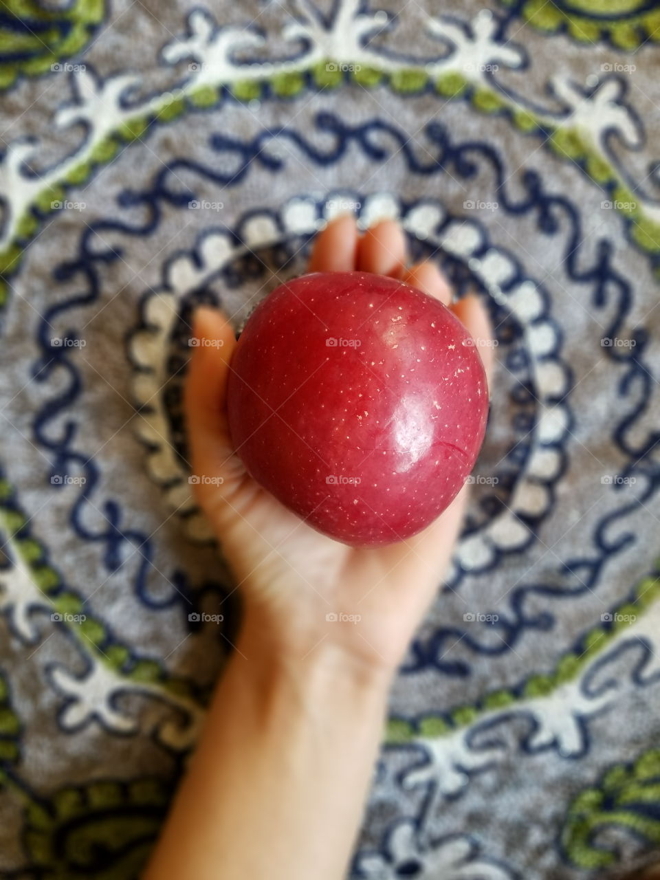 Holding apple