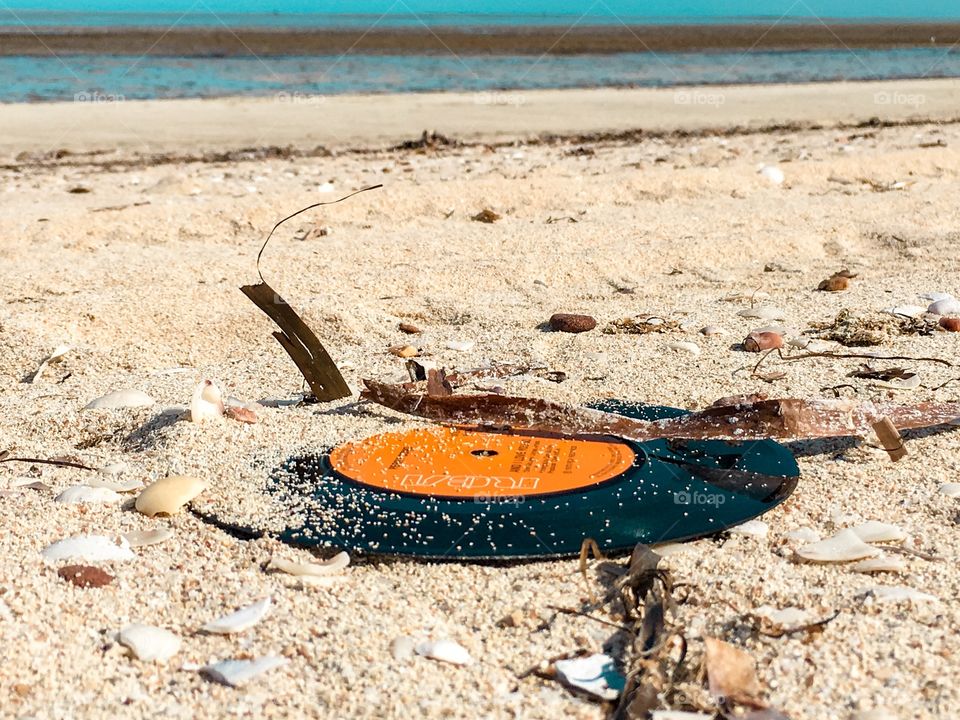 Beach scene vintage vinyl music records washed ashore 